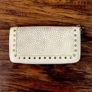 UNDER ONE SKY creme and gold purse.